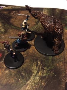 The three adventurers, a gold-loving thief, surly dwarf and surlier drow, get surprised by a bugbear.